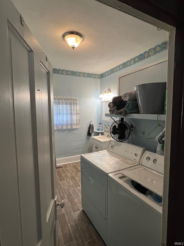 907 S 21st St, Lafayette, IN 47905 - washroom featuring separate washer and dryer, wood tiled floors, and baseboards
