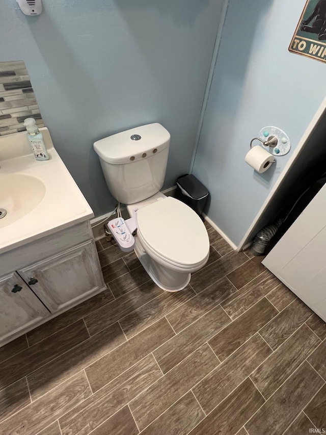 907 S 21st St, Lafayette, IN 47905 - bathroom with wood tiled floors, toilet, and vanity