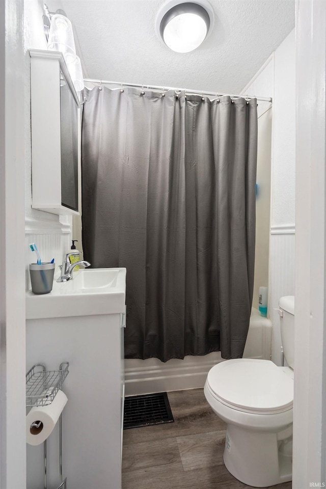601 W Sycamore St, Kokomo, IN 46901 - bathroom featuring toilet, wood finished floors, and vanity