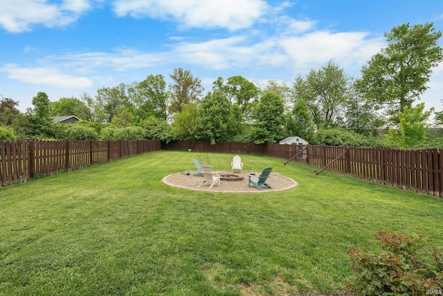 view of yard featuring an outdoor fire pit and a patio
