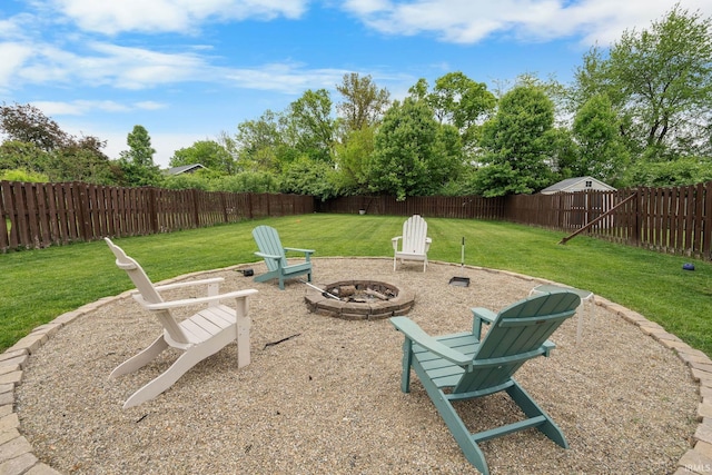view of yard with a fire pit