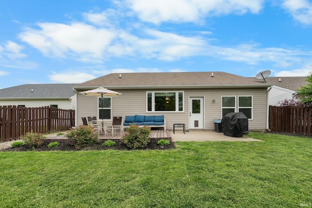 rear view of property featuring an outdoor hangout area, a patio area, and a wooden deck