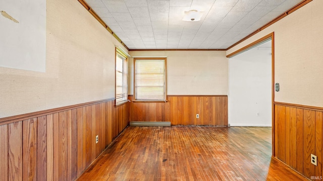 800 E 900 N, Decatur, IN 46733 - spare room with wood-type flooring, wood walls, crown molding, and wainscoting