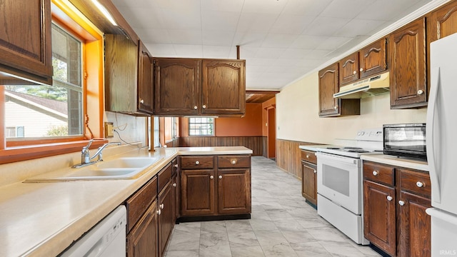 800 E 900 N, Decatur, IN 46733 - kitchen with white appliances, under cabinet range hood, a sink, light marble finish flooring, and wainscoting