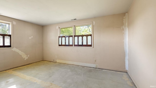 800 E 900 N, Decatur, IN 46733 - spare room with plenty of natural light, concrete flooring, and baseboards