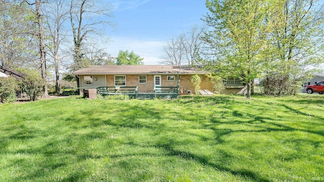 800 E 900 N, Decatur, IN 46733 - back of house with a deck, a yard, and brick siding