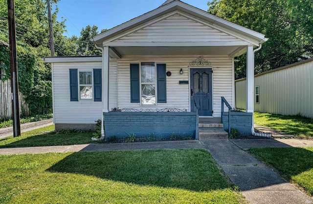 821 Mill St, Mount Vernon, IN 47620 - view of front of property featuring covered porch and a front lawn