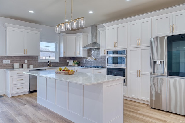 3530 Montgomery Ct, Newburgh, IN 47630 - kitchen with appliances with stainless steel finishes, wall chimney range hood, white cabinets, decorative backsplash, and recessed lighting