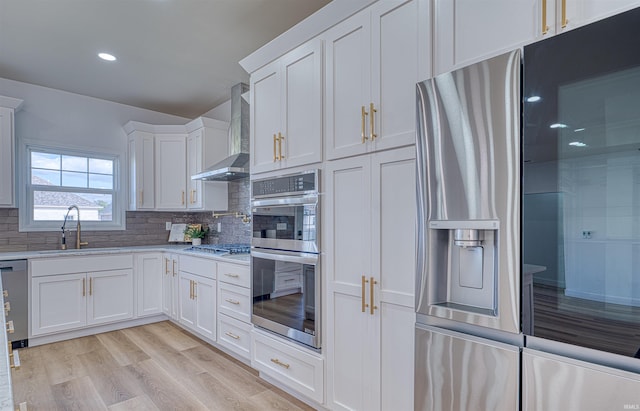 3530 Montgomery Ct, Newburgh, IN 47630 - kitchen featuring a sink, wall chimney exhaust hood, stainless steel appliances, white cabinets, and tasteful backsplash