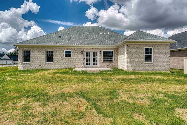 3530 Montgomery Ct, Newburgh, IN 47630 - rear view of property featuring roof with shingles, a patio area, a yard, brick siding, and french doors
