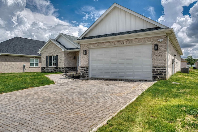 3530 Montgomery Ct, Newburgh, IN 47630 - ranch-style home with board and batten siding, brick siding, decorative driveway, a front yard, and an attached garage