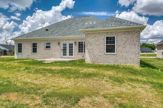 3530 Montgomery Ct, Newburgh, IN 47630 - rear view of house featuring a shingled roof, brick siding, a yard, a patio, and french doors