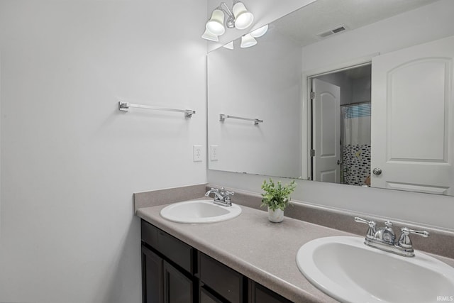 bathroom featuring double vanity