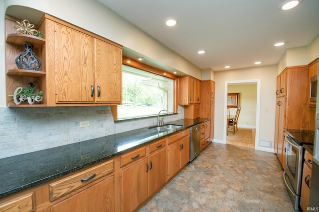 kitchen with a sink, stainless steel appliances, open shelves, baseboards, and stone finish floors