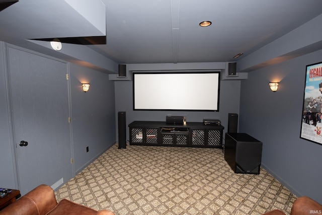 cinema featuring baseboards and light flooring