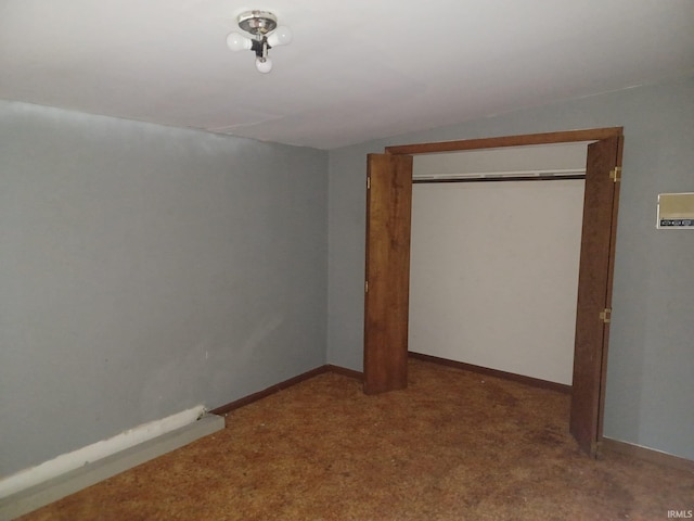 403 E Poplar St, Fort Branch, IN 47648 - unfurnished bedroom featuring carpet flooring, a closet, vaulted ceiling, and baseboards