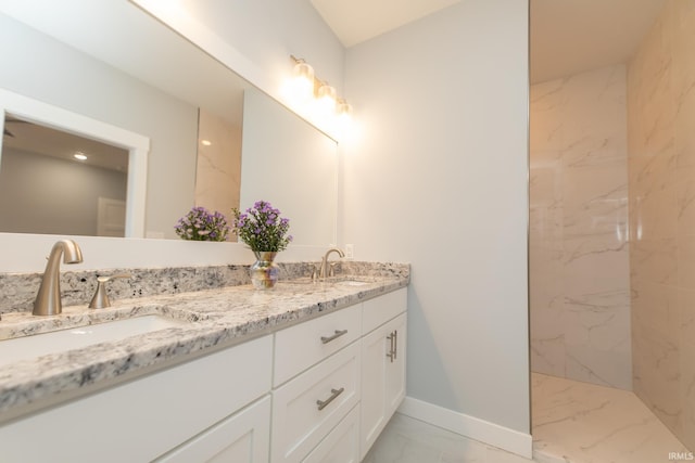 735 E Holland Dr, Bloomington, IN 47401 - full bath featuring marble finish floors, baseboards, double vanity, and a marble finish shower