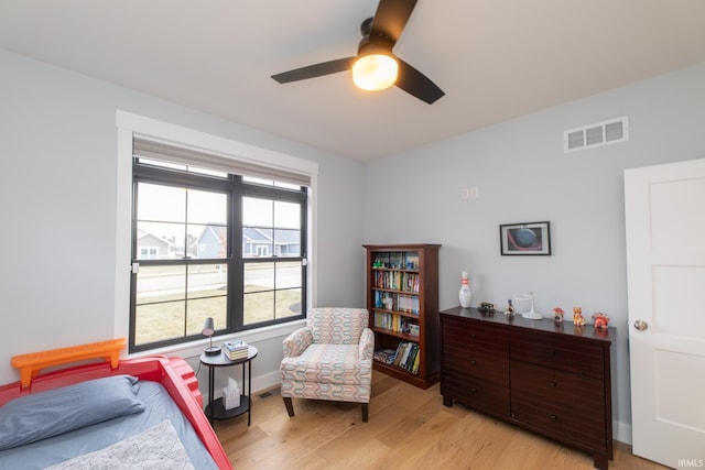 735 E Holland Dr, Bloomington, IN 47401 - bedroom with light wood finished floors, baseboards, and ceiling fan