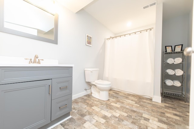 735 E Holland Dr, Bloomington, IN 47401 - full bathroom featuring toilet, baseboards, vanity, brick patterned flooring, and shower / tub combo