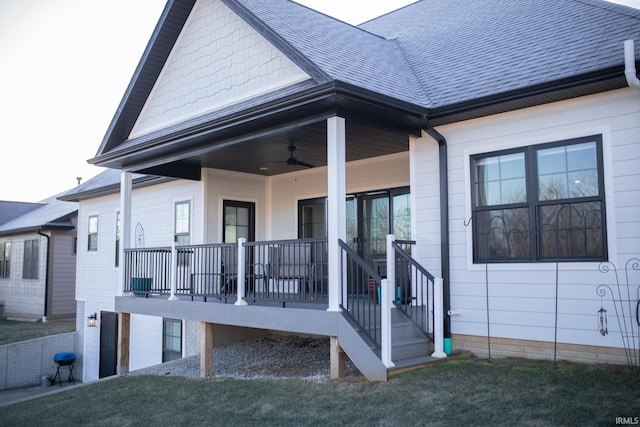 735 E Holland Dr, Bloomington, IN 47401 - back of house featuring a shingled roof, a yard, ceiling fan, and covered porch