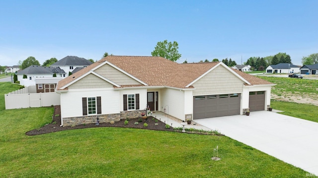201 Thoroughbred Ln, Auburn, IN 46706 - view of front facade with stone siding, a garage, and driveway