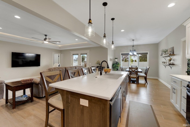 201 Thoroughbred Ln, Auburn, IN 46706 - kitchen featuring a sink, stainless steel dishwasher, healthy amount of natural light, a kitchen breakfast bar, and recessed lighting