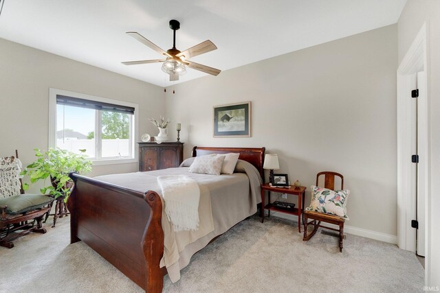 201 Thoroughbred Ln, Auburn, IN 46706 - bedroom featuring light colored carpet, baseboards, and ceiling fan
