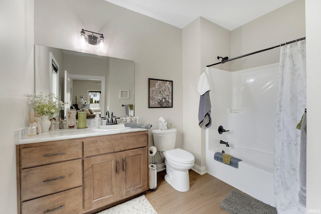 201 Thoroughbred Ln, Auburn, IN 46706 - bathroom featuring wood finished floors, toilet, vanity, and shower / bath combination with curtain