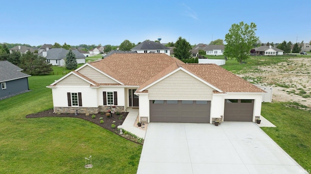 201 Thoroughbred Ln, Auburn, IN 46706 - view of front of property featuring an attached garage, stone siding, driveway, and a front lawn