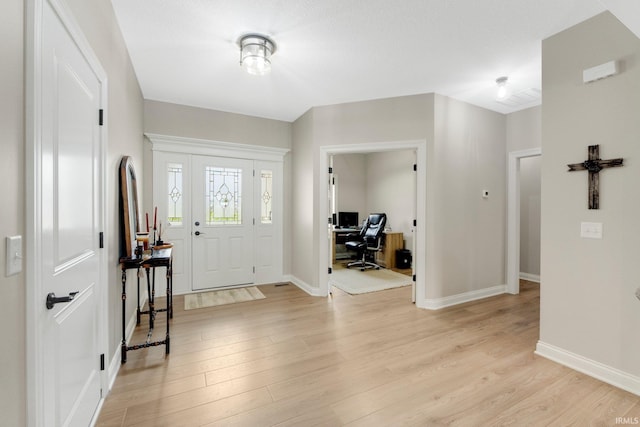 201 Thoroughbred Ln, Auburn, IN 46706 - foyer entrance with light wood-style floors and baseboards