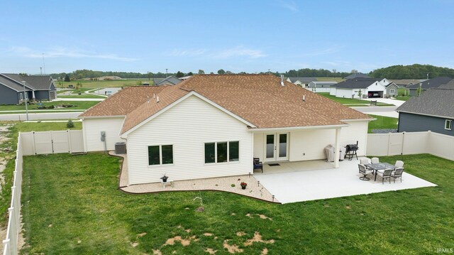 201 Thoroughbred Ln, Auburn, IN 46706 - back of property with a patio area, roof with shingles, french doors, a residential view, and central AC