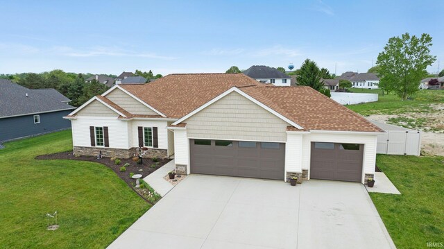 201 Thoroughbred Ln, Auburn, IN 46706 - view of front of property featuring a garage, stone siding, and driveway