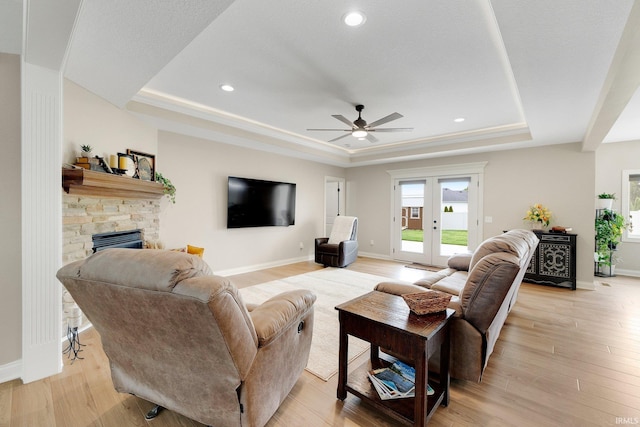 201 Thoroughbred Ln, Auburn, IN 46706 - living area with a raised ceiling, a fireplace, a ceiling fan, light wood-style flooring, and recessed lighting