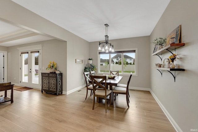 201 Thoroughbred Ln, Auburn, IN 46706 - dining room featuring healthy amount of natural light, light wood finished floors, and baseboards