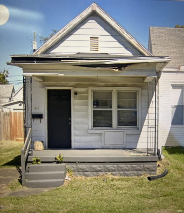 shotgun-style home with covered porch