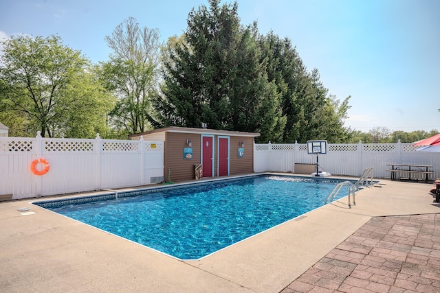 315 E Effie Mae St, North Webster, IN 46555 - view of swimming pool featuring a patio area, fence, and an outdoor structure