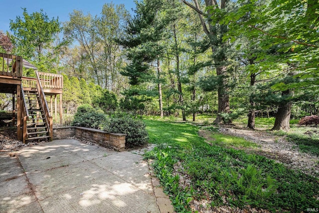 view of yard with stairway, a patio area, and a deck