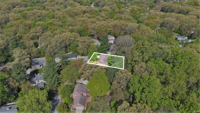 aerial view of property's location featuring a forest and property parcel outlined