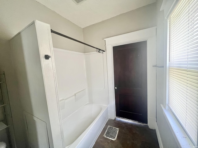 full bathroom with healthy amount of natural light and shower / tub combination