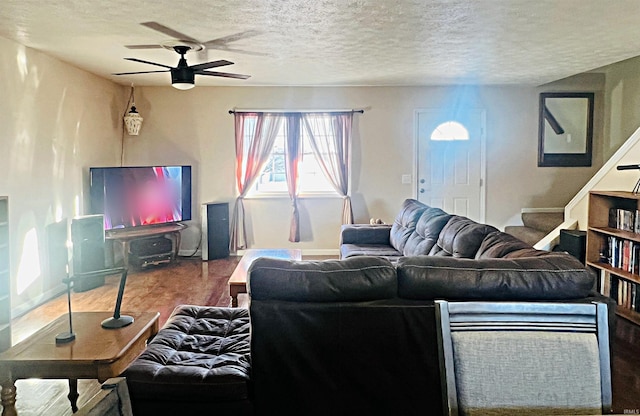 12820 E 150 N, Loogootee, IN 47553 - living room with ceiling fan, stairway, a textured ceiling, wood finished floors, and baseboards