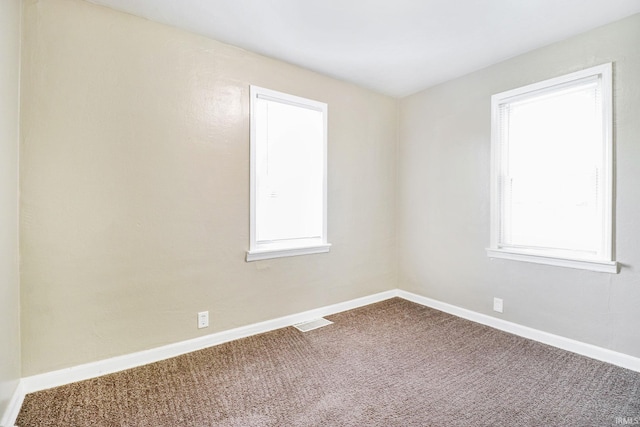 1714 S Warren St, South Bend, IN 46613 - carpeted empty room with baseboards