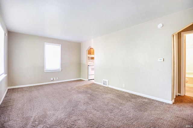 1714 S Warren St, South Bend, IN 46613 - carpeted empty room with a smoke detector and baseboards