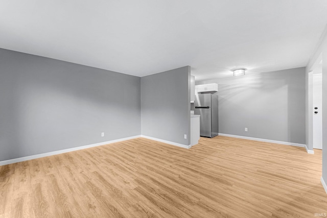 2937 Westbrook Dr Unit A-314, Fort Wayne, IN 46805 - unfurnished living room with light wood-type flooring and baseboards