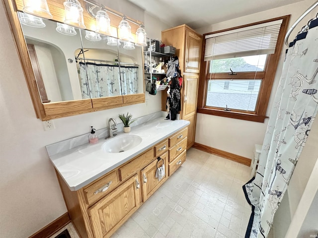 1655 Hinton Dr, Fort Wayne, IN 46808 - bathroom with baseboards, vanity, and a shower with curtain
