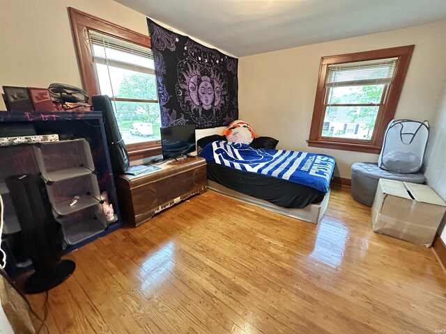 1655 Hinton Dr, Fort Wayne, IN 46808 - bedroom featuring wood finished floors and multiple windows
