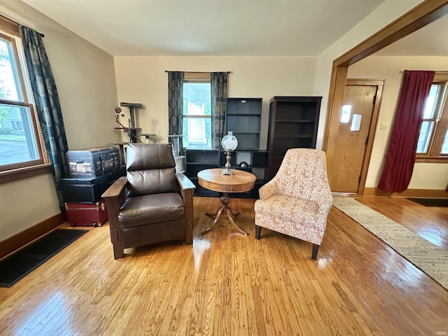 1655 Hinton Dr, Fort Wayne, IN 46808 - sitting room with light wood-style floors and healthy amount of natural light