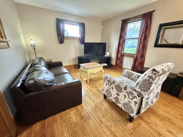 1655 Hinton Dr, Fort Wayne, IN 46808 - living area featuring wood finished floors and healthy amount of natural light