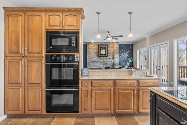 2344 E Linden Hill Dr, Bloomington, IN 47401 - kitchen featuring black appliances, light stone counters, a sink, decorative light fixtures, and ceiling fan