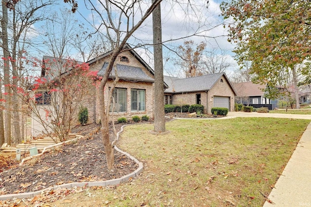 2344 E Linden Hill Dr, Bloomington, IN 47401 - view of front of house with a front lawn, a garage, roof with shingles, concrete driveway, and brick siding