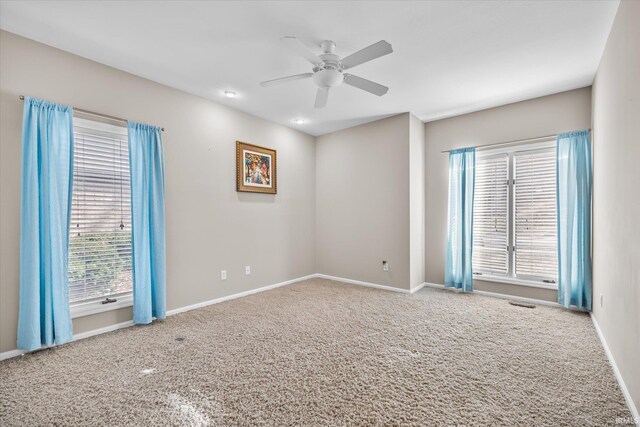 2344 E Linden Hill Dr, Bloomington, IN 47401 - empty room with carpet, ceiling fan, and baseboards